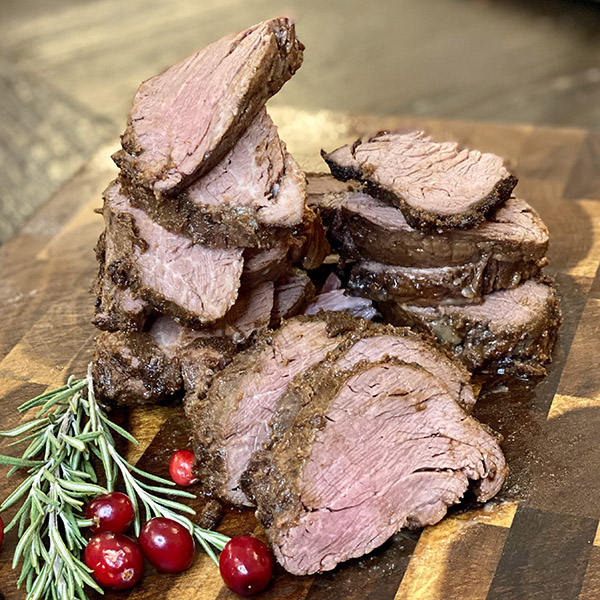 slices of beef tenderloin on a cutting board