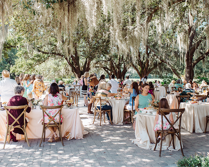 People sitting at tables outside