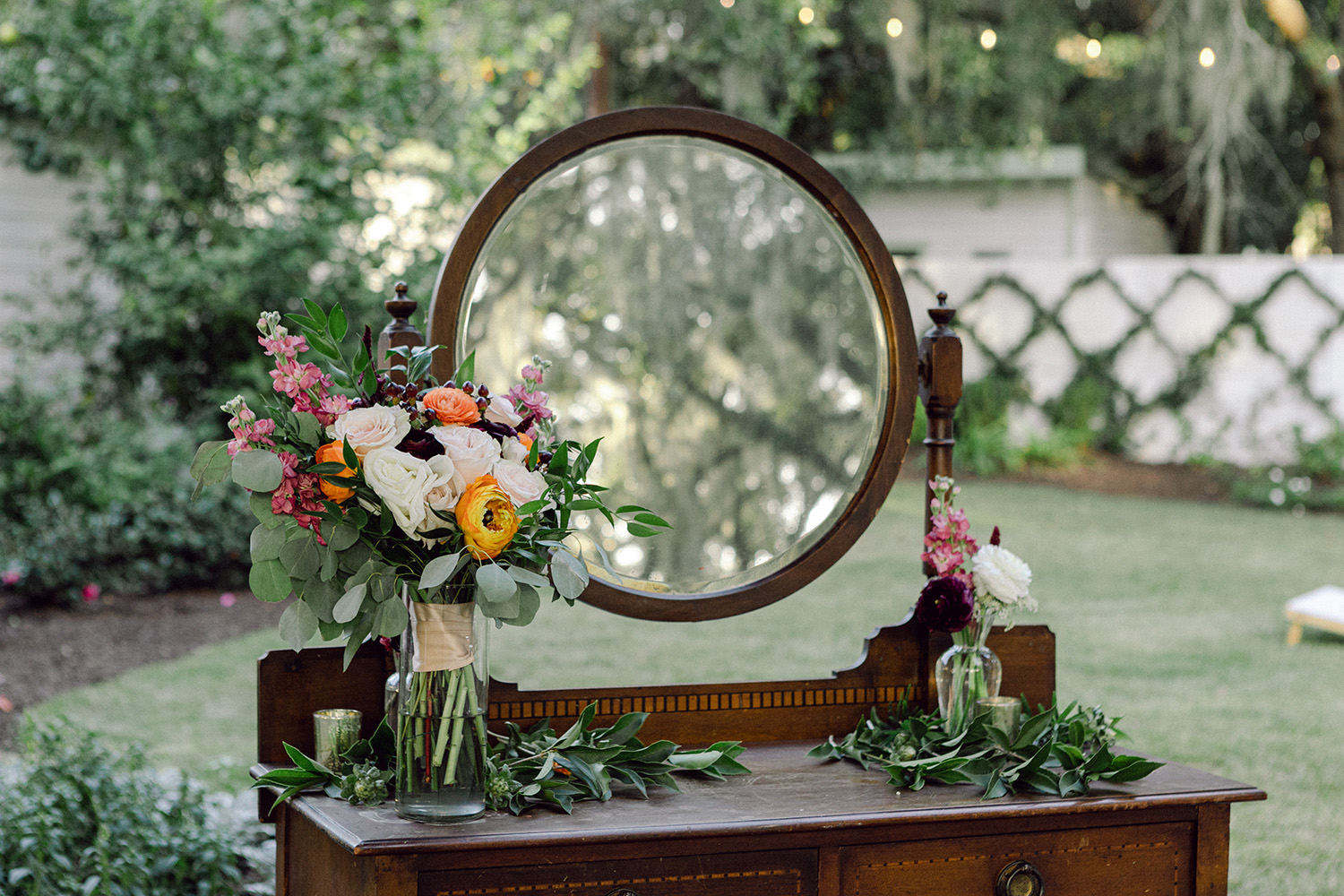 Decorated table with mirror and florals.