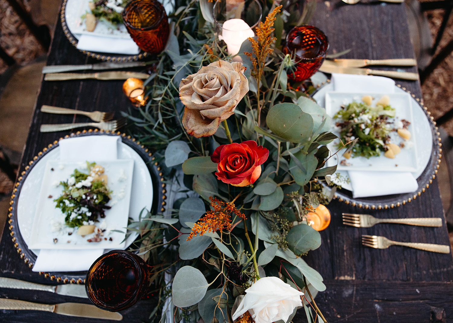Arranged table with florals in the center.