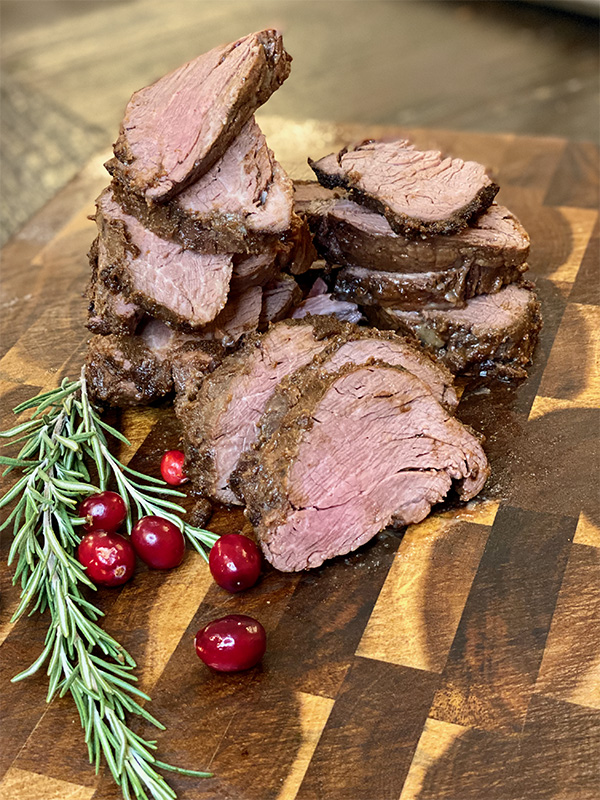slices of beef tenderloin on a cutting board
