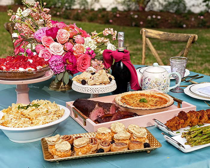 Mother's Day Brunch beautifully arranged on a table outdoors