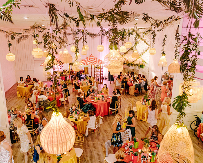 Gracie Ballroom at Hewitt Oaks decorated for a tropical-themed Summer Soirée